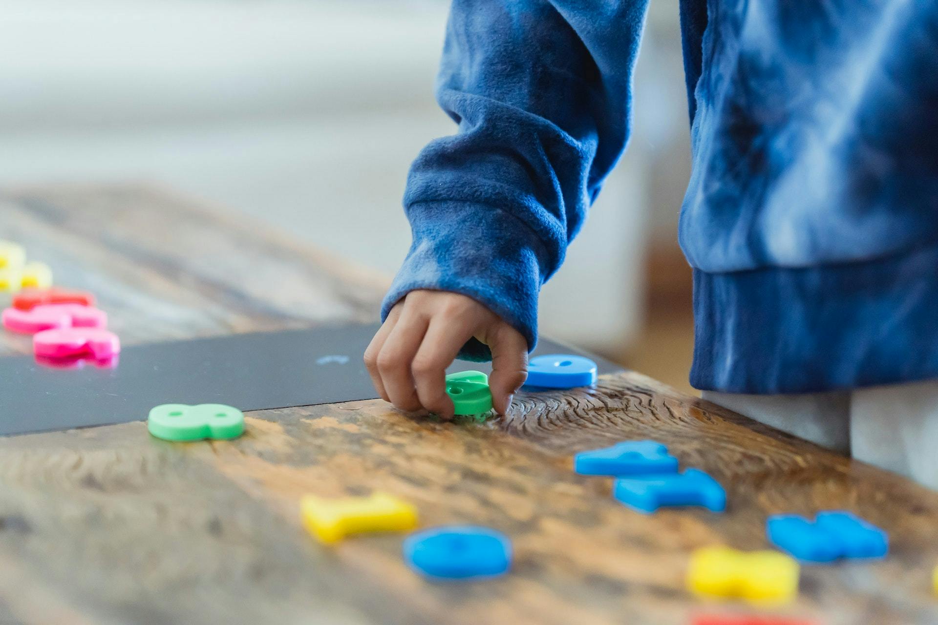 Student uses number blocks to play classroom math games