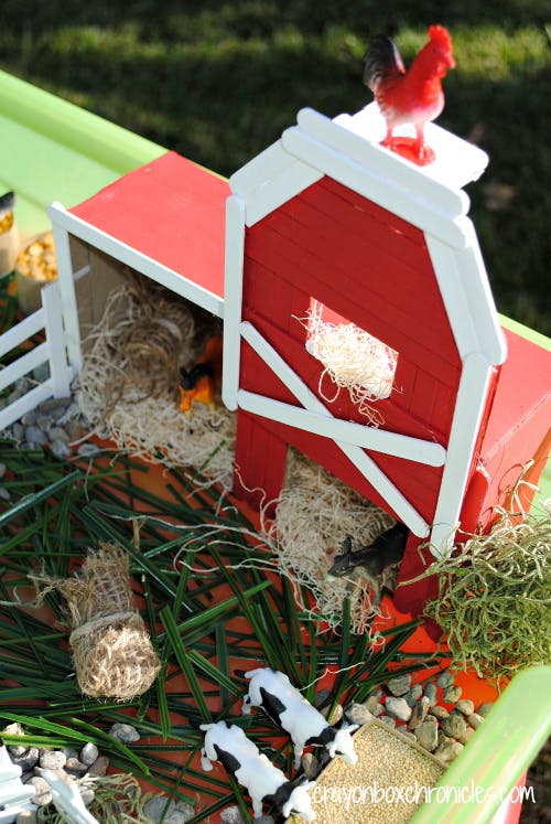 Red barn made of popsicle sticks. 